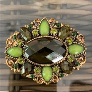 Gold Brooch with green and brown stones